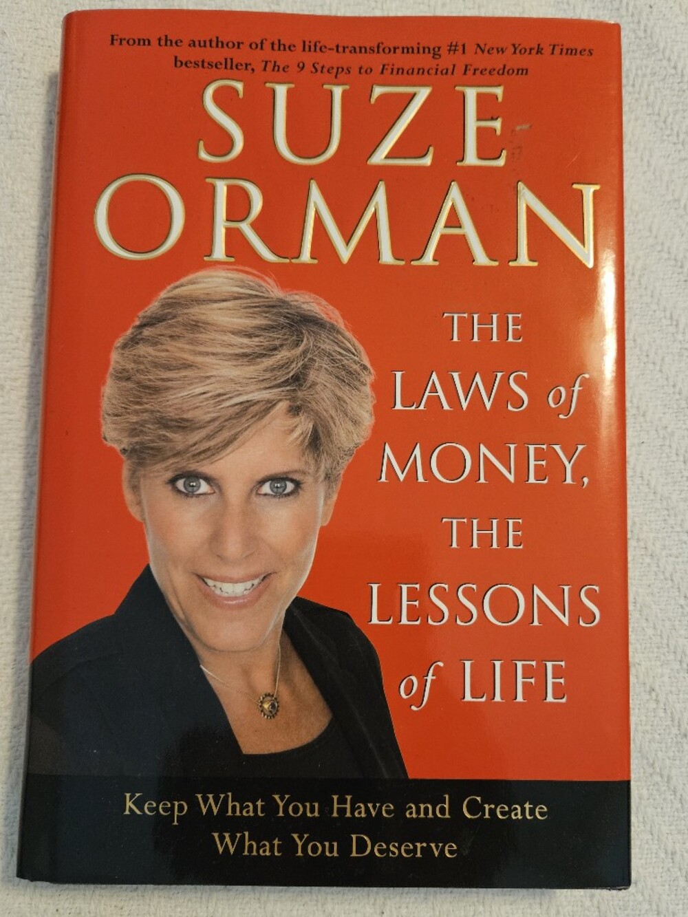 Suze Orman "The Laws of Money, The Lessons of Life" - Orange Hardcover
